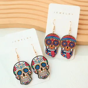 Close-up detail view of colorful Gothic sugar skull earrings for Halloween festival