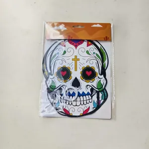 Detailed view of Mexican Day of the Dead sugar skull banner in retail packaging