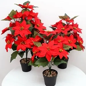 Artificial red poinsettia potted plants for Christmas holiday festive home decoration