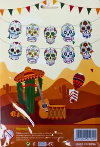 Close-up of Mexican Day of the Dead party banner featuring colorful sugar skulls and cactus