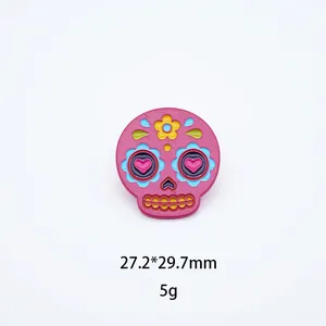 Detail view of pink Mexican sugar skull enamel pin with 27.2x29.7mm dimensions