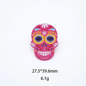 Detailed view of a colorful pink Mexican sugar skull brooch showing dimensions 27.5x39.6mm