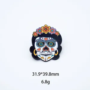 Close-up of Mexican sugar skull enamel pin with vibrant floral crown and detailed drip oil art.