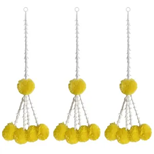 Set of three yellow artificial marigold garlands for festive Indian wedding decoration