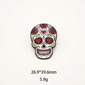 Macro view of Mexican sugar skull enamel pin with colorful floral heart details
