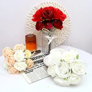 Close-up detail of white and champagne artificial rose bouquets for festive holiday decoration