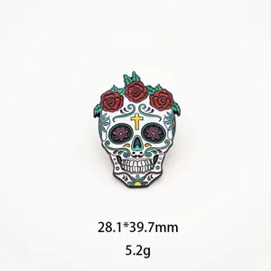 Close-up detail of a colorful Mexican sugar skull enamel pin decorated with red roses