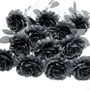 Macro detail view of multiple black artificial roses for Halloween gothic home decor