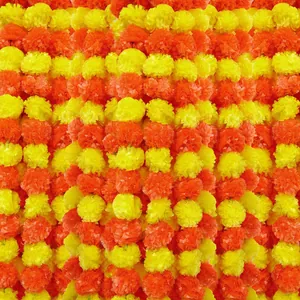 Vibrant yellow and orange artificial marigold garlands for Day of the Dead festival decor