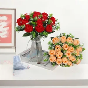 Detailed view of realistic red and champagne artificial rose bouquets in a vase