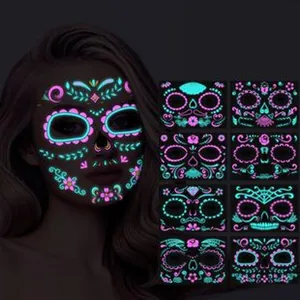 Glow in the dark neon face tattoos with floral skull designs for Halloween makeup