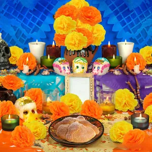 Levendige kunstmatige goudsbloemen in een traditionele Dag van de Doden altaar setting