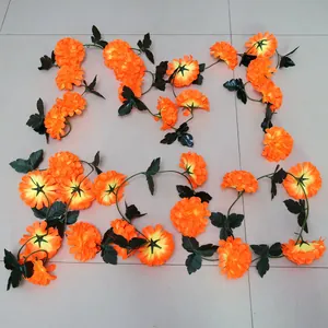 Vibrant orange artificial marigold garland strands for Day of the Dead party decoration.
