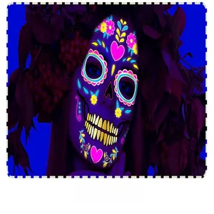 Detail of neon Day of the Dead face tattoo sticker with fluorescent floral patterns.