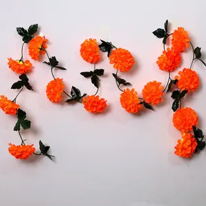 Vibrant orange artificial marigold garlands for Day of the Dead and Halloween decoration