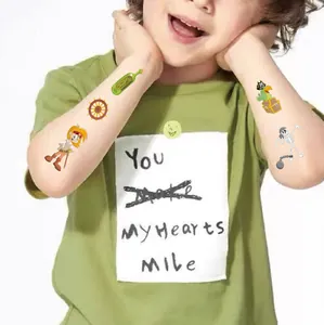 Close-up of pirate and skeleton themed temporary tattoo stickers on a child's arm