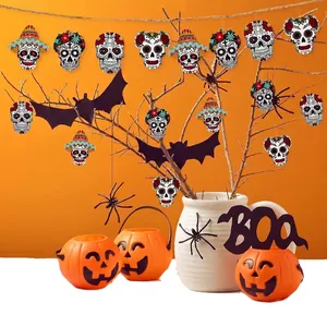 Colorful Day of the Dead wooden skull pendants hanging on branches for festive decor