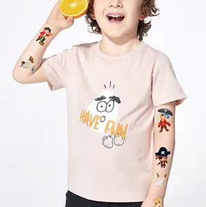 Kid wearing colorful pirate temporary tattoos featuring cartoon characters and swords