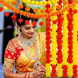 Vibrant orange and yellow marigold flower garlands for wedding and festival decor