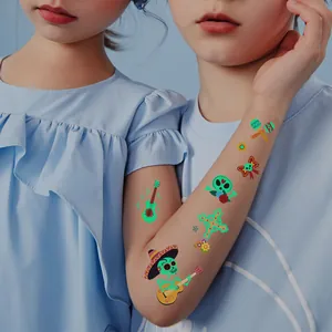 Luminous Day of the Dead temporary tattoos for kids featuring cute cartoon skeleton designs