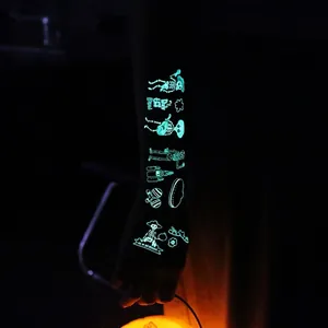 Glow-in-the-dark Day of the Dead temporary tattoo stickers featuring skull designs