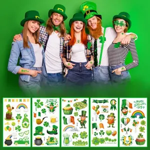 Detailed view of 5 sheets of St. Patrick's Day temporary tattoo stickers with shamrocks.