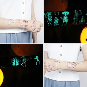 Luminous Day of the Dead tattoo stickers with cartoon skeleton designs for kids' parties