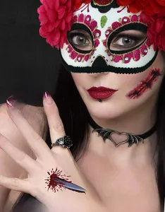Detailed view of Day of the Dead half-face mask and horror wound tattoo stickers for Halloween party
