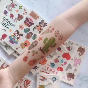 Colorful Day of the Dead temporary tattoo stickers for kids with skull and guitar designs.