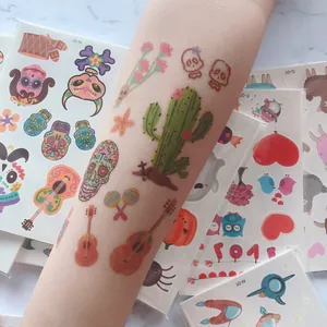 Vibrant Mexican Day of the Dead temporary tattoo stickers with colorful skull and guitar patterns