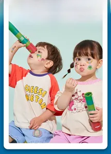 Detail of children wearing Mexican Day of the Dead themed temporary tattoos on their faces