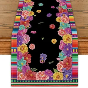 Traditional Mexican Fiesta table runner featuring colorful floral patterns on black linen fabric