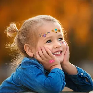 Young girl wearing vibrant Day of the Dead temporary face tattoos for kids' Halloween party