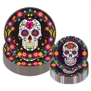 Detail of Day of the Dead decorative paper plates featuring colorful sugar skull party patterns