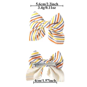 Detailed dimensions and weight for the striped bow hair clip with alligator metal base