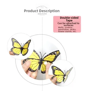 Close-up of simulated monarch butterfly wall sticker showing double-sided adhesive application.