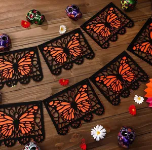 Detailed view of laser-cut Monarch butterfly felt banner for Day of the Dead decorations