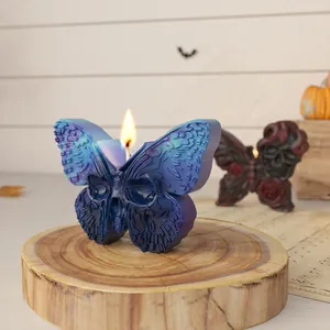 Candela a farfalla blu con teschio per decorazioni di Halloween o Giorno dei Morti.