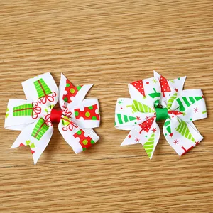 Festive Christmas ribbon hair clips for kids featuring red and green holiday bow designs