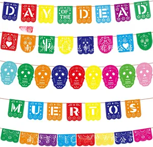 Detailed view of colorful felt Day of the Dead banners with intricate skull and floral cutouts
