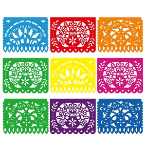 Intricate hollow patterns on colorful Mexican party banners for Day of the Dead decor