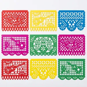 Detailed view of colorful Day of the Dead Mexican papel picado banners with cut-outs.