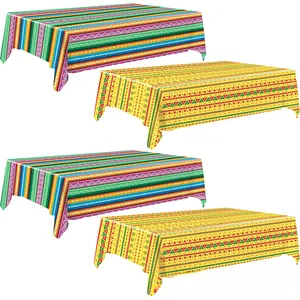 Vibrant Mexican fiesta tablecloths with striped and geometric patterns for party decor.
