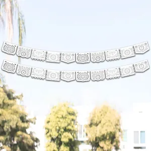Close-up detail of white hollowed Mexican party banner decorations for wedding parties
