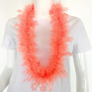 Detailed view of neon pink star tinsel garland on mannequin for carnival party decor