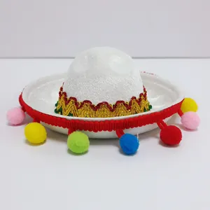 Mini white Mexican sombrero with colorful pom-poms and red trim for party decor.
