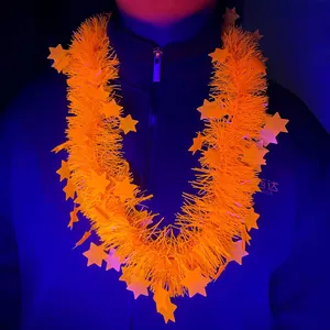 Vibrant neon orange fluorescent star tinsel garland shown worn on neck for rave parties