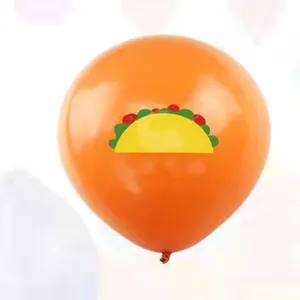 Detail view of a vibrant orange latex balloon featuring a festive taco design for parties