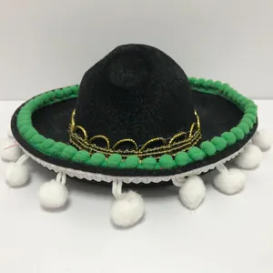 Detailed view of mini black Mexican sombrero with green and white pom-pom trim