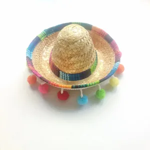 Miniature Mexican straw sombrero featuring vibrant colorful striped bands and hanging pom-poms